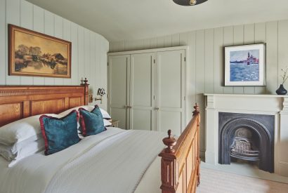 A double bedroom with fireplace at Harold House, Isle of Wight