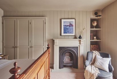 A fireplace in the bedroom at Harold House, Isle of Wight