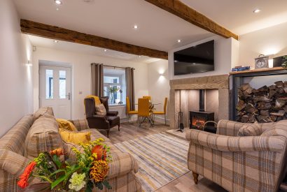 The living room with log burner at The Lee, Yorkshire