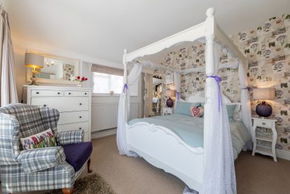 A four poster bed at Sweet Shop Cottage, Somerset