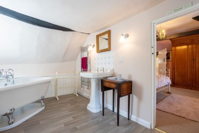 A family bathroom with free standing bath at Sweet Shop Cottage, Somerset