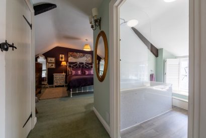 A double bedroom with an ensuite at Thatch Corner, Somerset