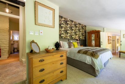 A large double bedroom with an ensuite at Thatch Corner, Somerset