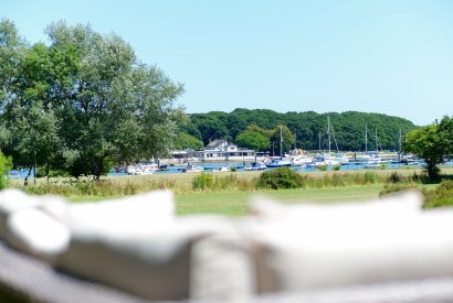 The outdoor seating area with views across the harbour at Brickworks and Vines, Isle of Wight