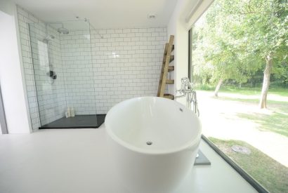 A large family bathroom with free standing bath at Brickworks and Vines, Isle of Wight
