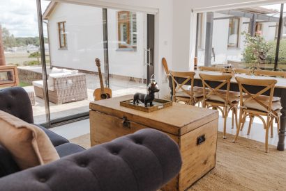 The living and dining room with access to the garden at Brickworks and Vines, Isle of Wight