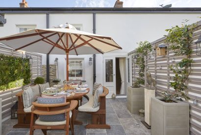 The outdoor patio and dining area at The Beach House, Devon