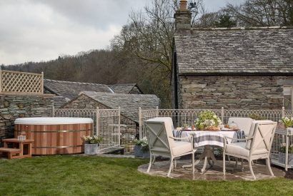 The outdoor dining table at hot tub at Beatrix Cottage, Lake District