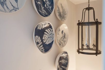 Wall decor and hanging lights at Beatrix Cottage, Lake District