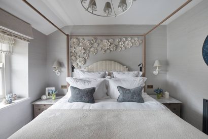 A bedroom with four poster bed at Beatrix Cottage, Lake District