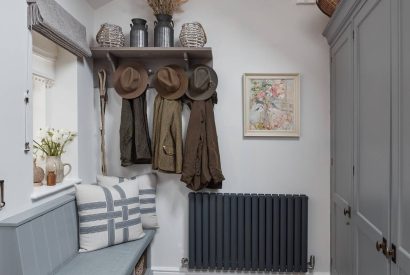 A utility room with bench seat at Beatrix Cottage, Lake District
