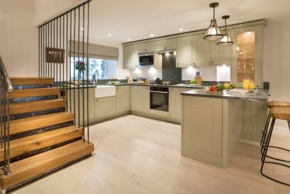 The open plan kitchen and staircase at Shepherd's View, Lake District