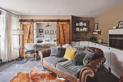 The two-seater sofa in the open-plan living space at Mimosa Cottage, Vale of Glamorgan