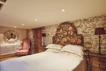 A king-size bedroom at Lotus Cottage, Vale of Glamorgan