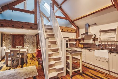 The kitchen and staircase to the mezzanine level at Lotus Cottage, Vale of Glamorgan