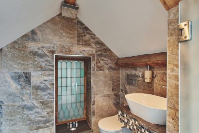 An en-suite shower room at Lotus Cottage, Vale of Glamorgan
