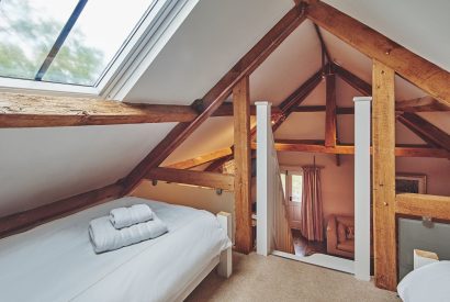 The twin bedroom on the mezzanine floor at Lotus Cottage, Vale of Glamorgan
