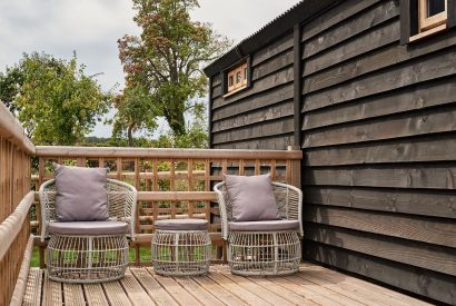 Two garden chairs on the decking at The Hangout Hut, Worcestershire 