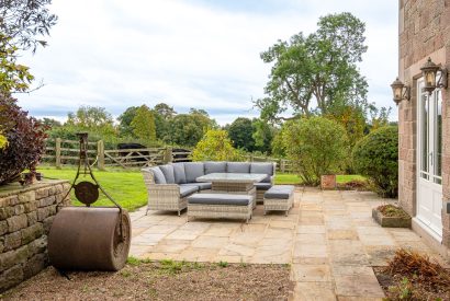 The rattan garden furniture on the patio at Tinkers Folly, Yorkshire