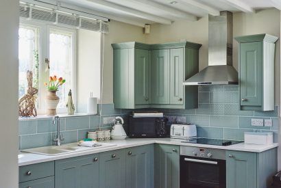 The kitchen with views over the countryside at Osborne Lodge, Herefordshire