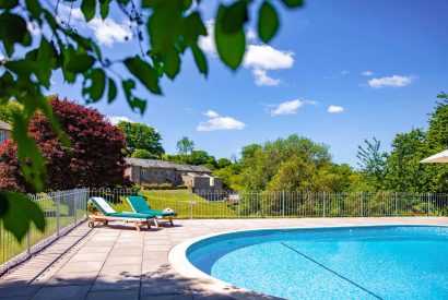 The outdoor swimming pool at Fern House, Devon