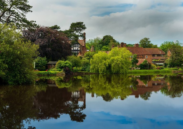 A beautiful view of Beaulieu in Hampshire overlooking the still river towards pretty houses