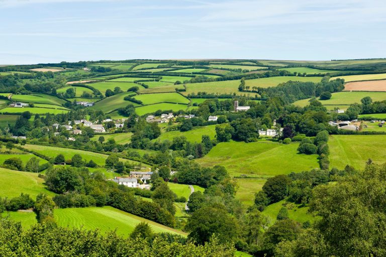 Hills and green fields in the countryside near the village of Exford in Exmoor