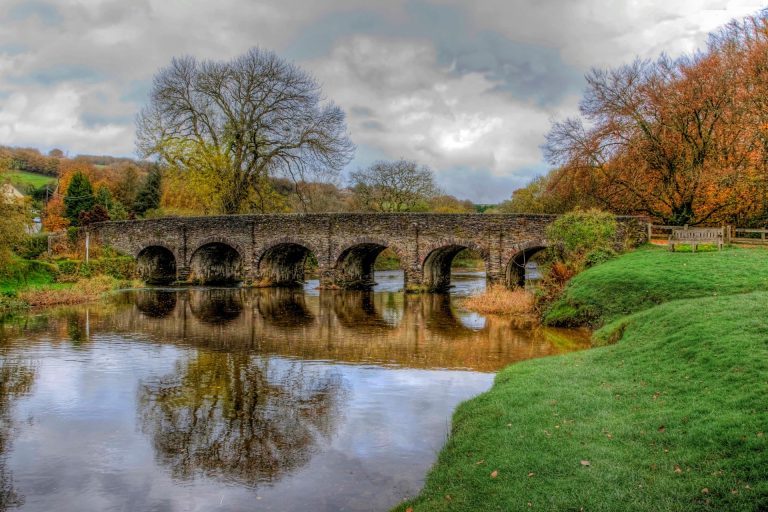 Old bridge with six arches over the river at the village of Withypool in Exmoor