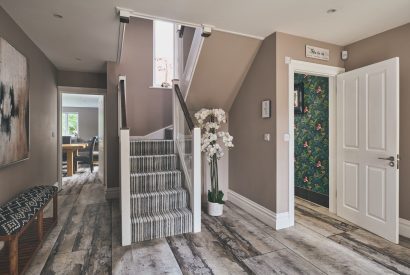The entrance hall with a WC leading to the open-plan living space at Sharnbrook Retreat, Bedfordshire