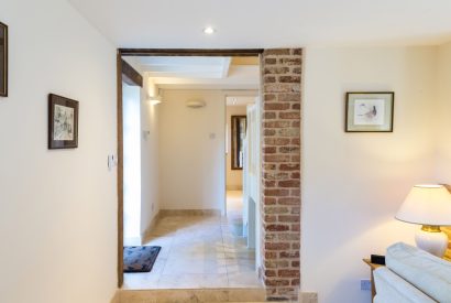 The entrance hall leading towards the living room at Brightwaters Stables, Hampshire