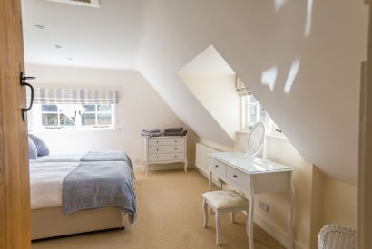 A large double bedroom at Brightwaters Stables, Hampshire
