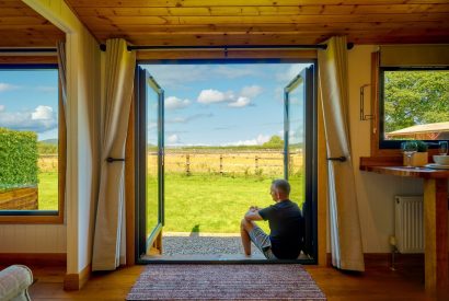 The double doors overlooking the countryside view at Abberley Shepherd's Hut, Worcestershire