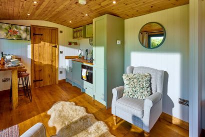 The kitchen and living space at Abberley Shepherd's Hut, Worcestershire