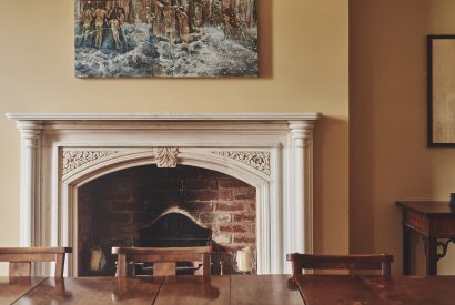 The open fire in the dining room at Heron House, Peak District