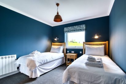 A twin bedroom at Pine Cabin, Loch Lomond