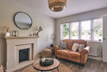 The living room with fireplace at Bay Tree Cottage, Cotswolds