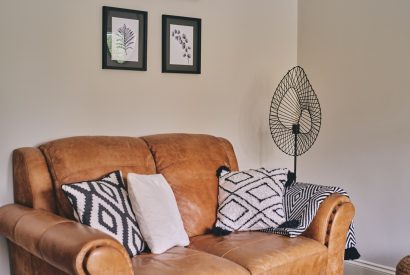 The leather sofa at Bay Tree Cottage, Cotswolds
