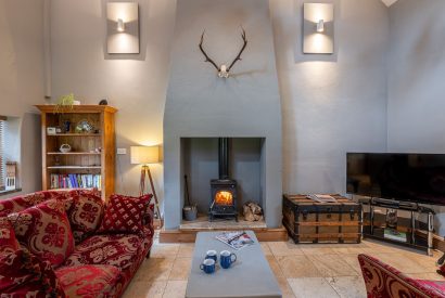 The living room with log burner at Waterside Cottage, Yorkshire