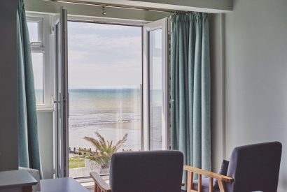 A bedroom with sea view at Beach Manor, West Sussex