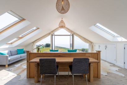 The master bedroom with a sitting area at Minack View, Cornwall