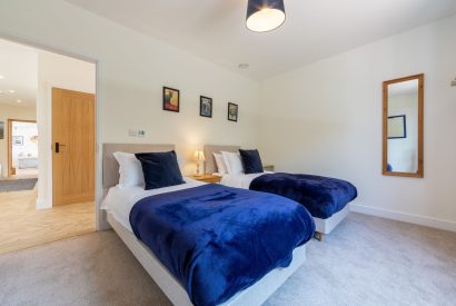A twin bedroom on the ground floor of Minack View, Cornwall
