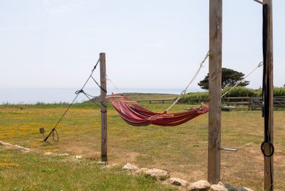 A hammock in the garden, overlooking the sea at Minack View, Cornwall