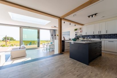 The open-plan kitchen and dining room with a sea view at Minack View, Cornwall