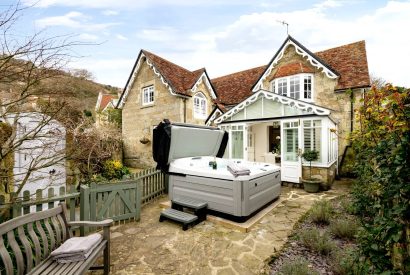 The exterior and hot tub at Rose Cottage in the Isle of Wight