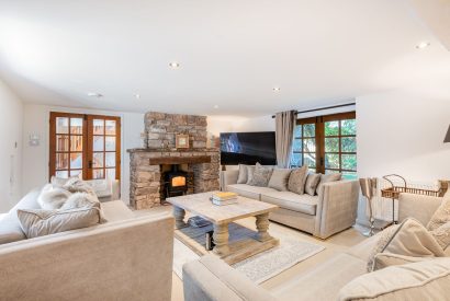 The living room with a log-burning stove at Rose Walls, Lake District 