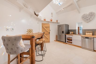 The kitchen bar with cushioned stools at Rose Walls, Lake District 