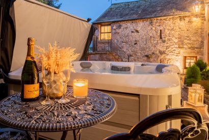 The private hot tub at night at Rose Walls, Lake District 
