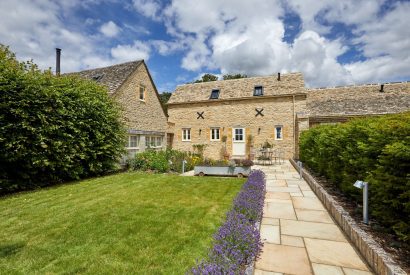 The garden and exterior of Haymaker Barn, Cotswolds