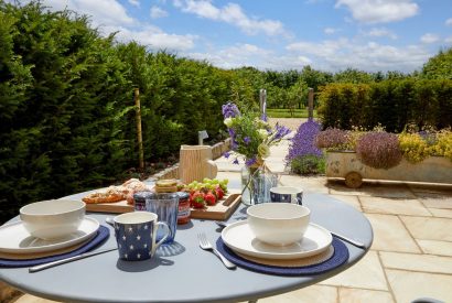 Breakfast on the patio at Haymaker Barn, Cotswolds