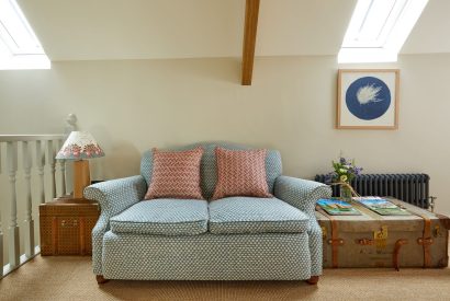 The sitting area in the bedroom at Haymaker Barn, Cotswolds